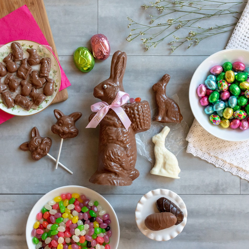 Easter bunny, an orange chocolate bunny, white chocolate bunny, 2 bunny suckers, a half pound of Easter minikins, a half pound of foiled eggs, marshmallow & cream eggs, and jelly beans