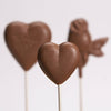2 heart and rose shaped chocolate suckers